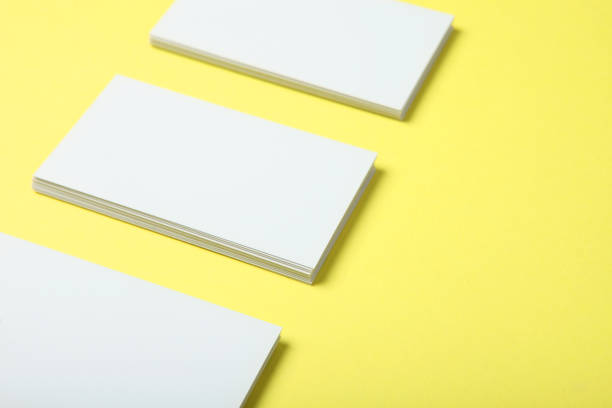 istock business cards on a colored background top view. Place to insert text 1272303982
