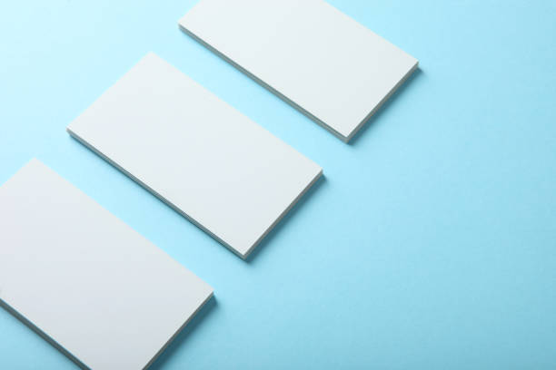 istock business cards on a colored background top view. Place to insert text 1272303986