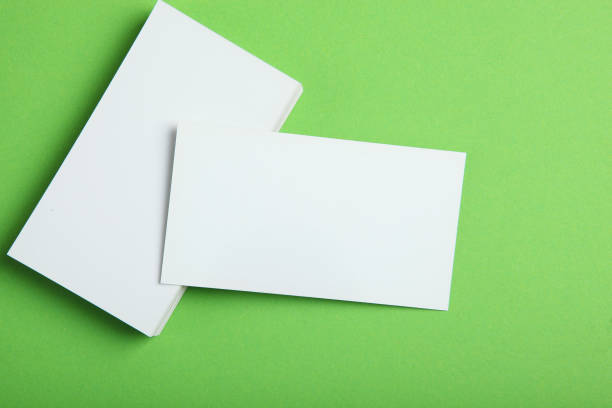 istock business cards on a colored background top view. Place to insert text 1272303992