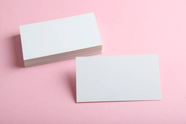 istock business cards on a colored background top view. Place to insert text 1272304013