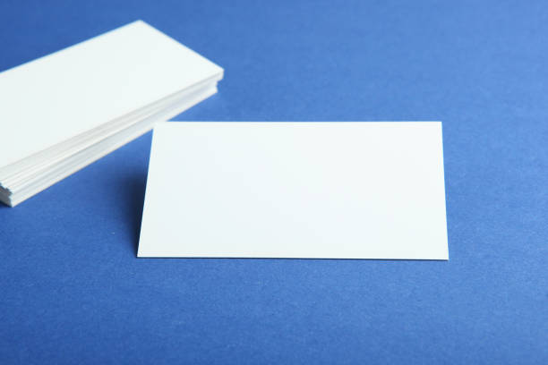 istock business cards on a colored background top view. Place to insert text 1272304028