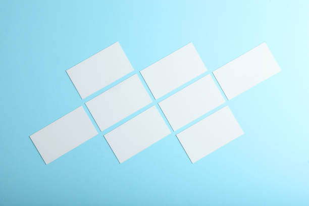 istock business cards on a colored background top view. Place to insert text 1272304054