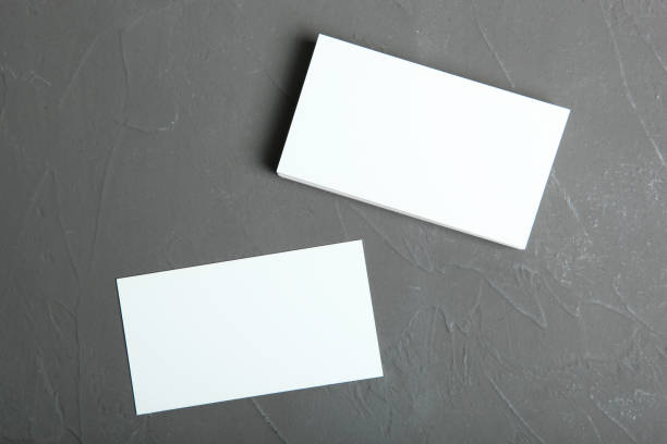 istock business cards on a colored background top view. Place to insert text 1272304245