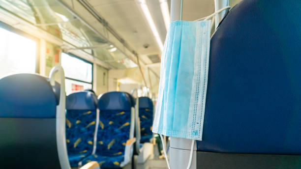 istock Empty inside train bus subway public transport with window view and blue seats people tourist new normal social distancing safe travel with hygiene face mask protect from covid corona virus 1272304472