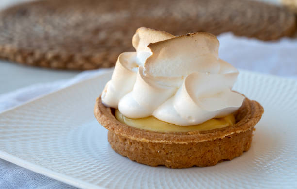 istock One piece of lemon tart with white eggs meringue 1272305241