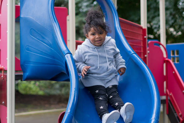 istock Happy Child Enjoys Playing At A Park 1272305623