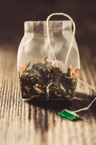 istock Tea bag on wooden background 1272305633