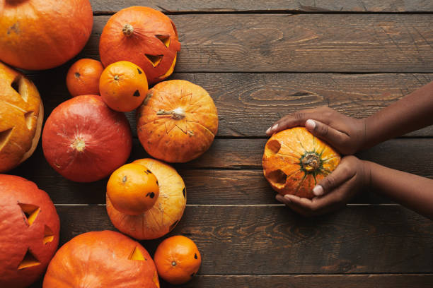 istock Woman Holding Pumpkin Flat Lay 1272311558