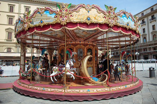 Florence, Italy - April 08, 2018: Carousel with horse figures for children in Florence, Tuscany, Italy