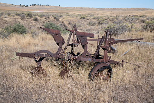 Unused old farming equipment in rural Montana USA