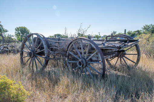 Unused old farming wagon in rural Montana USA on 150 year old ranch