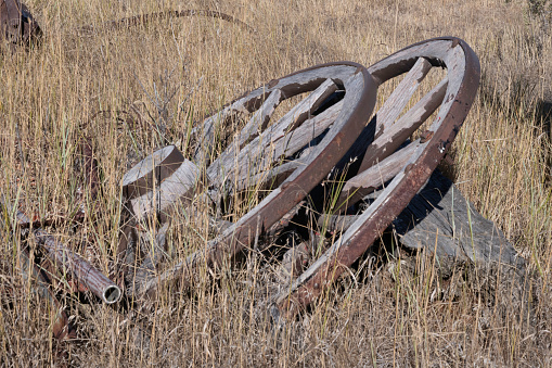 Unused old farming wagon wheels in rural Montana USA on 150 year old ranch