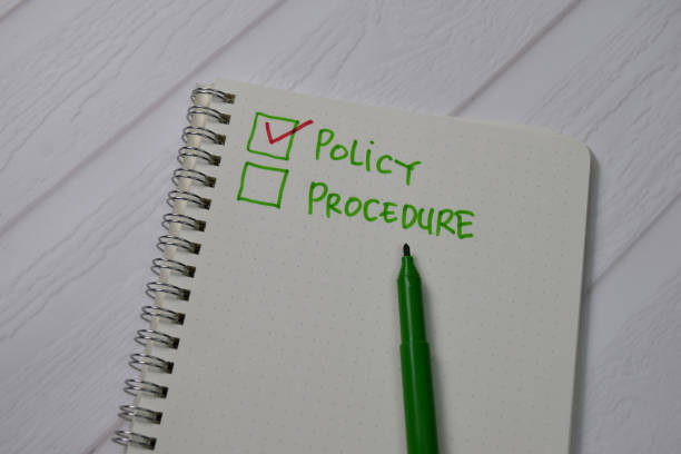 istock Policy and Procedure write on a book. Supported by an additional services isolated wooden table. 1272317553