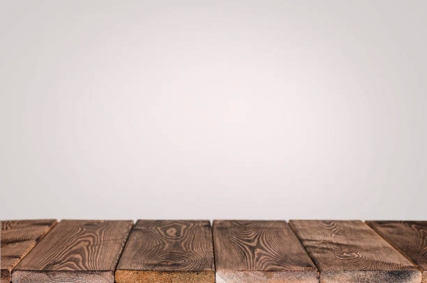 istock wood table top on the gray background 1272319166