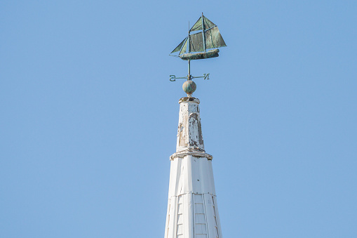 Steeple With Old Fashioned Sailing Ship On Top
