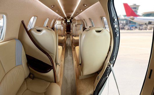 The interior of a chartered business jet at the airport.