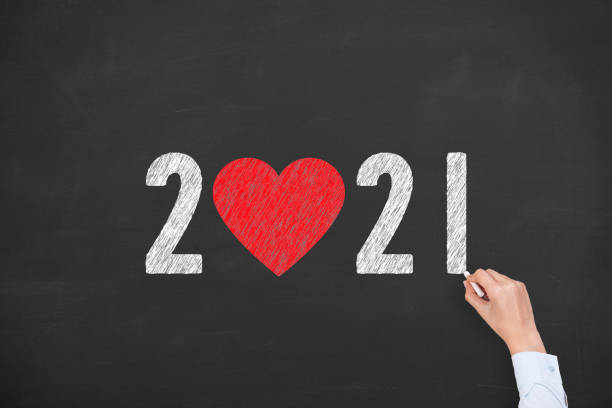 New Year 2021 with Heart Shape on Chalkboard Background