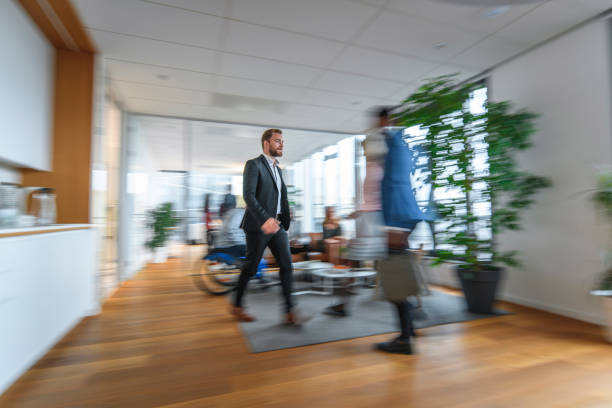Businessmen blur in the workplace in office with computer or shallow depth of focus of abstract background.