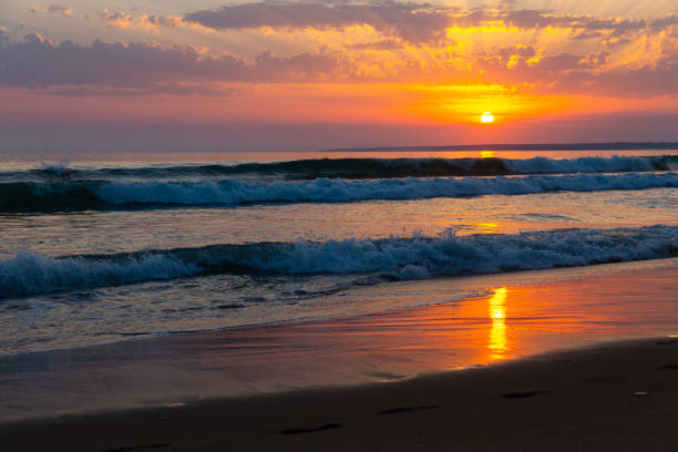 istock Summer sunny ocean waves and sunset in colorful tones 1272330461