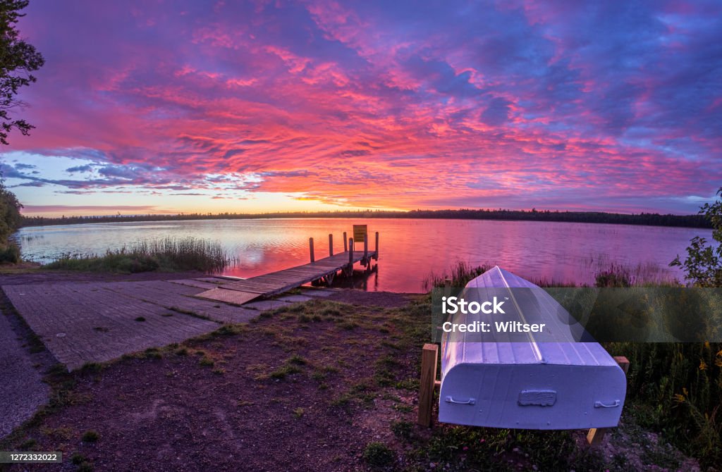 Marl Lake Magenta Life Boat Sunrise Marl Lake Magenta Life Boat Sunrise, Roscommon, Michigan Michigan Stock Photo