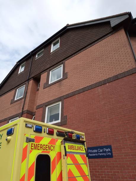 istock Ambulance parked by residential block 1272332248