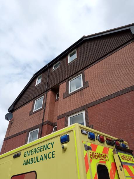 istock Ambulance parked by residential block 1272332252