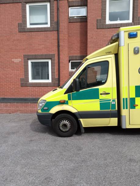 istock Ambulance parked by residential block 1272332254