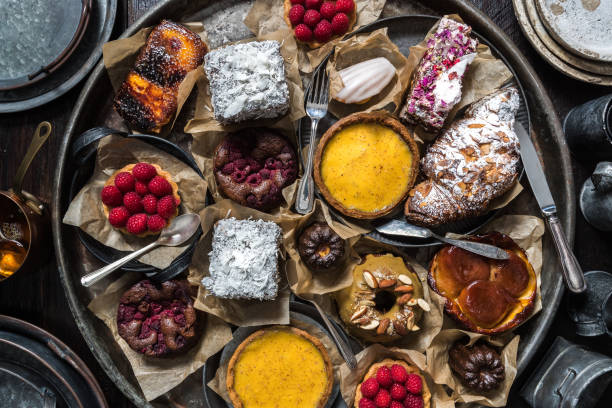 Delicious cakes and tarts in a rustic vintage table setting