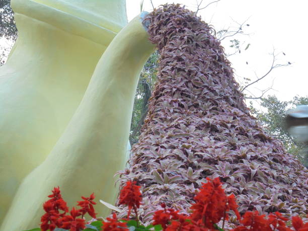 Flowers from a large teapot sculpture