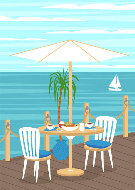 istock Breakfast in cafe with sea view. Wooden pier with rope fence. 1272341952