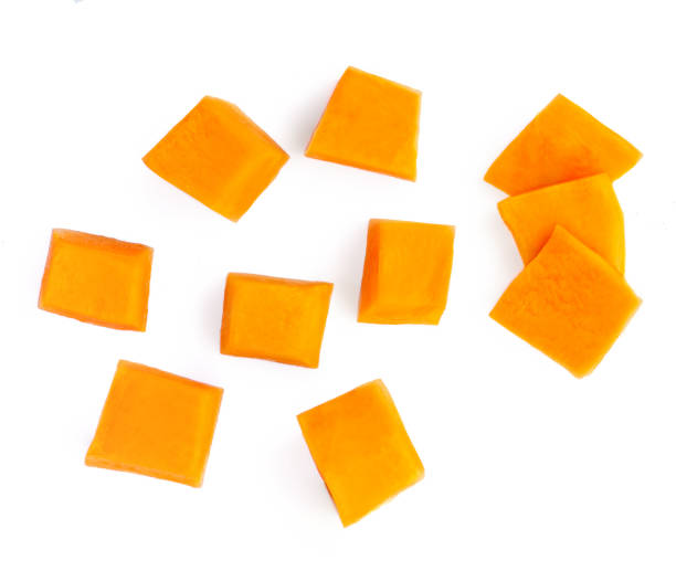 istock Pumpkin vegetable cube slice isolated on white background. Top view. Autumn Pumpkin Thanksgiving food 1272342573