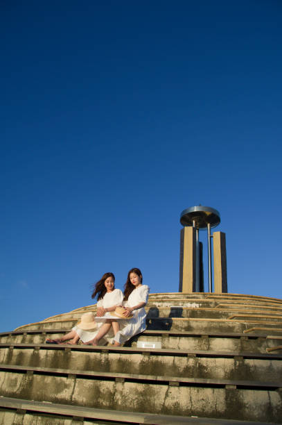 istock Two women in white dress 1272343422