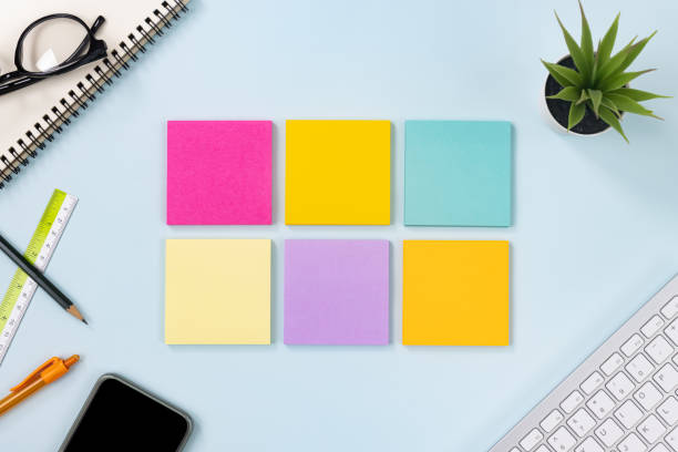 istock Top View 6 Color Sticky Note or Note Pad on Blue Pastel Minimalist Background 1272343594