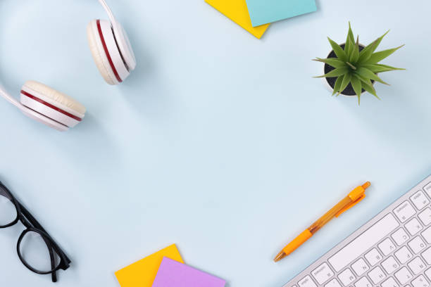 istock Modern Creative Top View Office Desk or Table on Blue Pastel Minimalist Background 1272343645