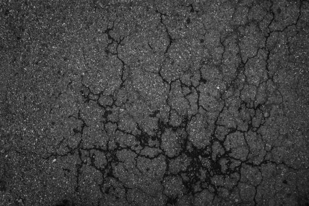 istock Crack background texture of rough asphalt top view 1272344320