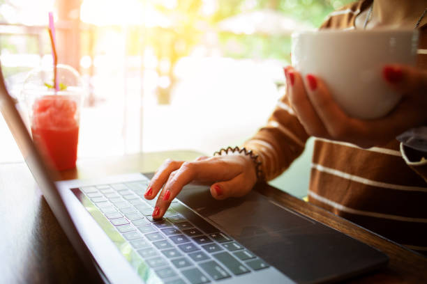 istock businesswoman hands searching for data on Notebook with analyzing charts at his workplace.concept 1272347757