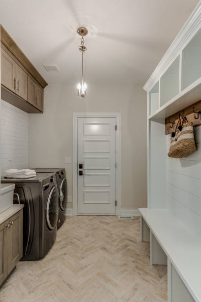 istock Entry corridor combining mudroom and laundry room 1272358394