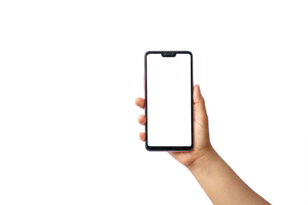 istock Man hand holding a black smartphone with a blank screen isolated on white background, clipping path. 1272362225