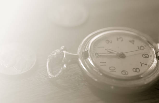 istock Pocket watch on wooden table 1272367403