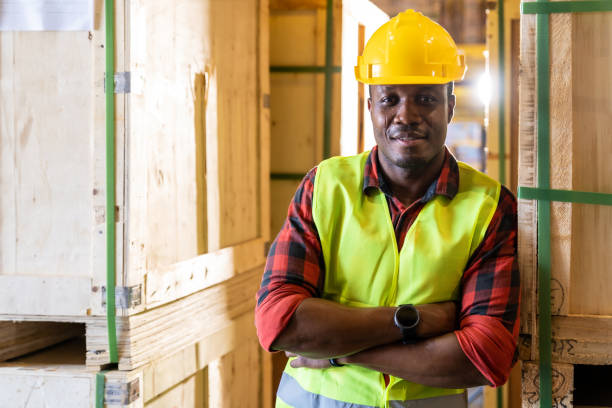 istock Portrait of Afican Black warehouse worker. 1272368944