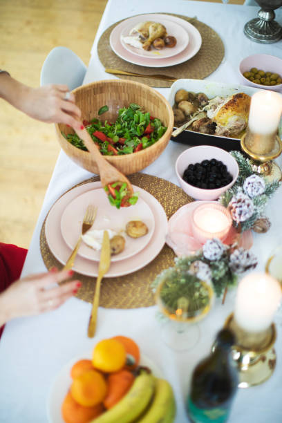 istock Flat-lay of friends eating at Christmas table 1272369962