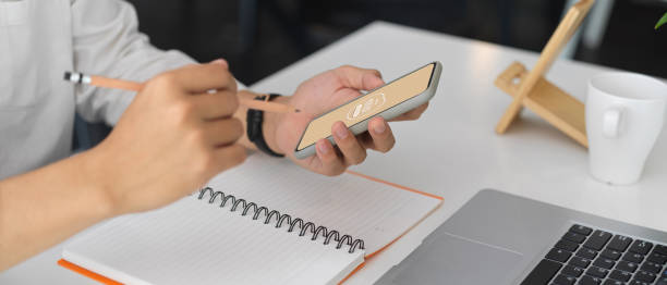 istock Businessman working on his idea with mock up smartphone 1272370075