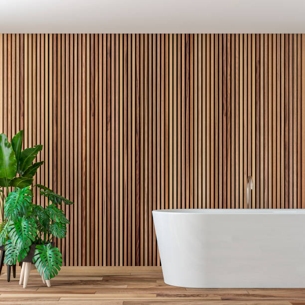 Empty luxury modern bathroom interior stock photo Empty luxury modern bathroom interior with hardwood parquet floor and empty wooden paneled wall with copy space. Self-standing bathtub on the right and potted plants on a side. 3D rendered image. wood paneling photos stock pictures, royalty-free photos & images
