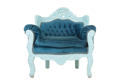 Blue baroque comfortable armchair isolated on a white background seen from the front