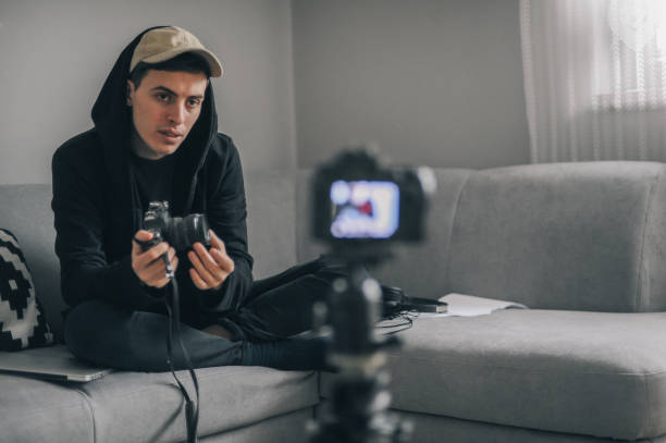 istock Young photographer making a video blog 1272372400