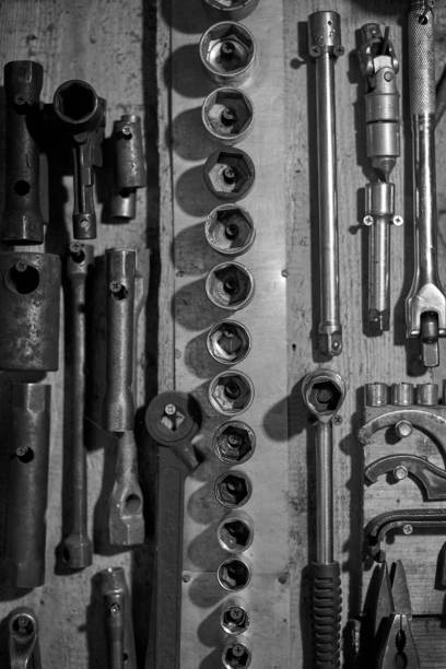 istock Work tools on the garage wall, black and white photo. 1272373401