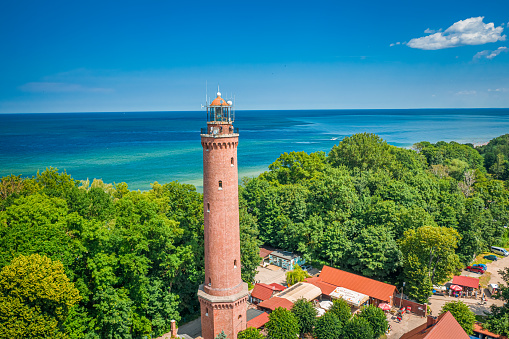 Aerial view of lighthouse on sunrise by Baltic Sea, Poland