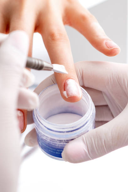 istock Process of applying acrylic powder on the nails 1272374759