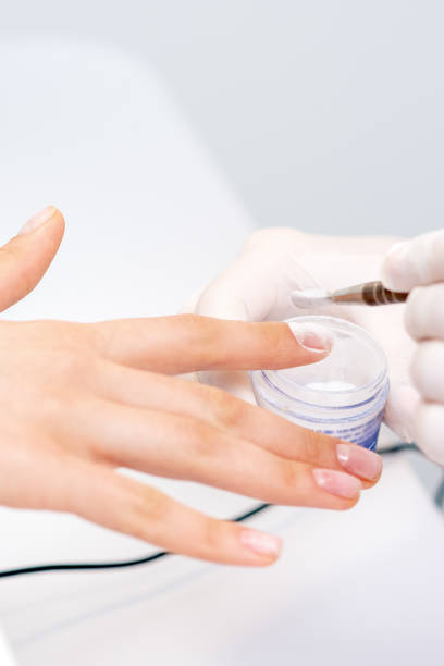 istock Process of applying acrylic powder on the nails 1272374773