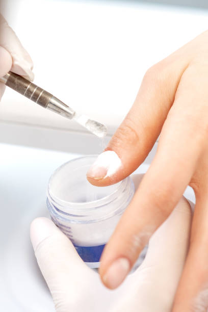 istock Process of applying acrylic powder on the nails 1272374781